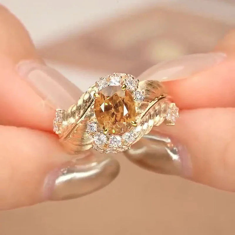 Gold colour copper feather ring with geometric embossing and yellow zircon stone centre