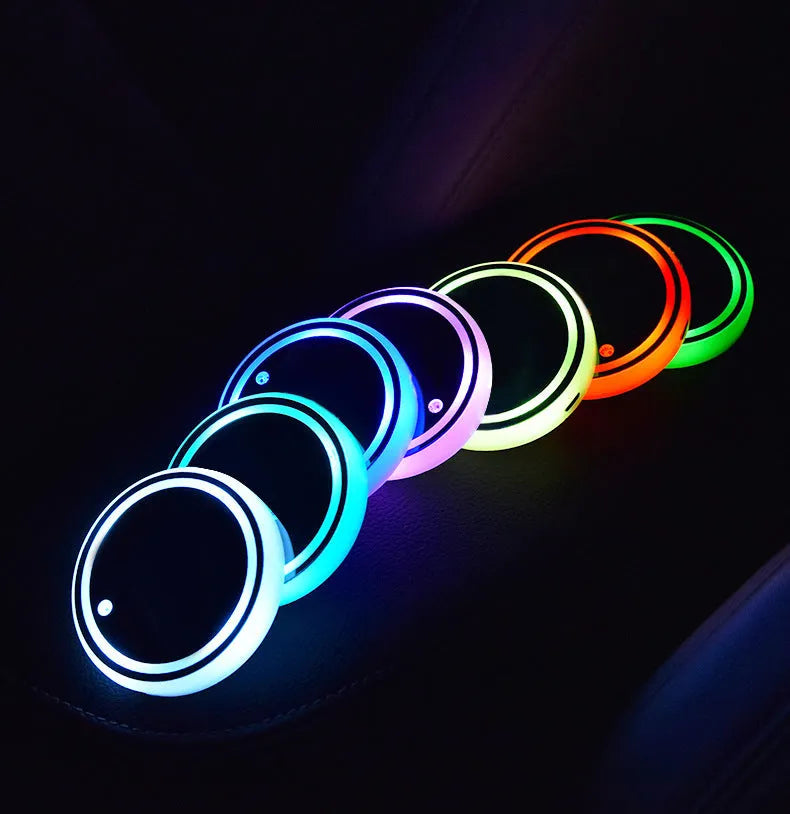 Colourful LED light-up coaster for car cup holder showing seven light modes on a non-slip acrylic surface.