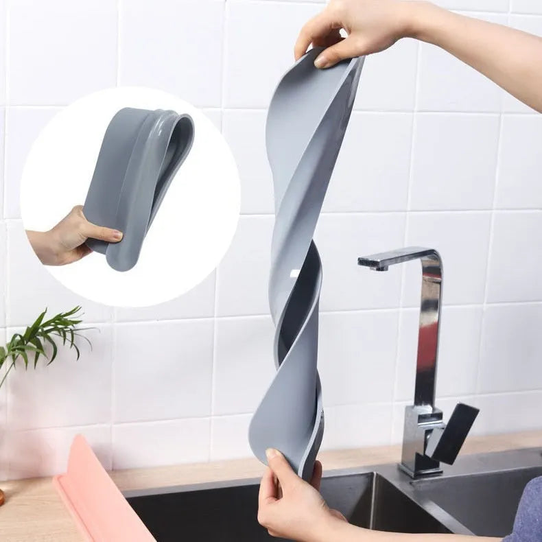 A thick grey silicone water blocking plate for a kitchen sink, showing its dimensions.