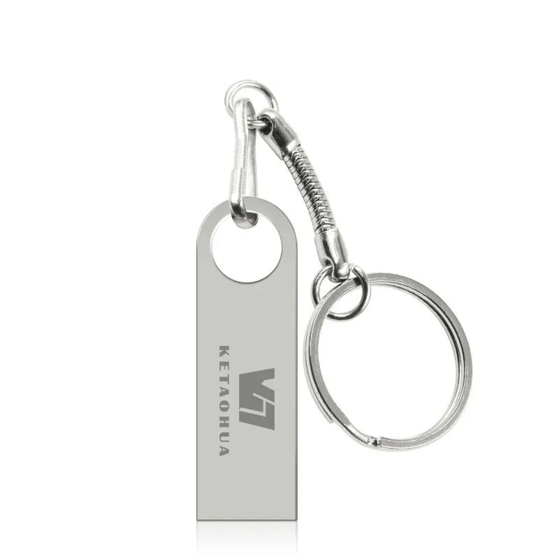 Metal car-shaped USB flash drive in silver finish showing compact size and USB connector.