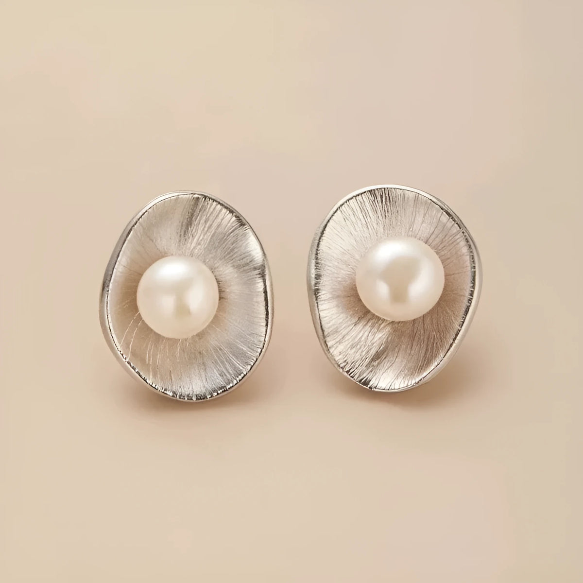 Gold coloured geometric pearl sterling silver needle ear studs for women.