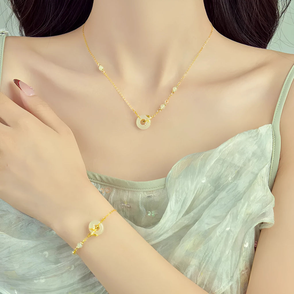 Women's antique-style 925 silver bracelet with Hetian jade and a gold-toned safety buckle clasp.