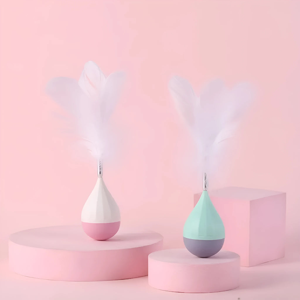 Green or pink feather tumbler cat toy with self-healing base and goose feather teaser.