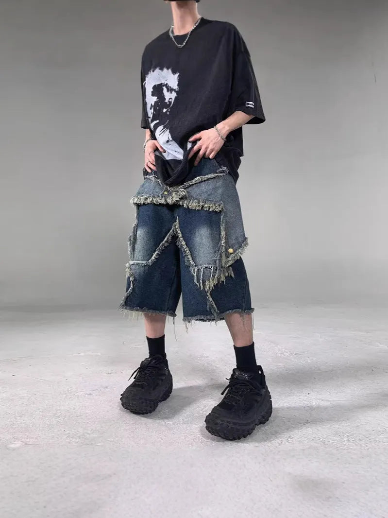 Blue denim shorts with frayed five-pointed star design, loose fit, shown from front view